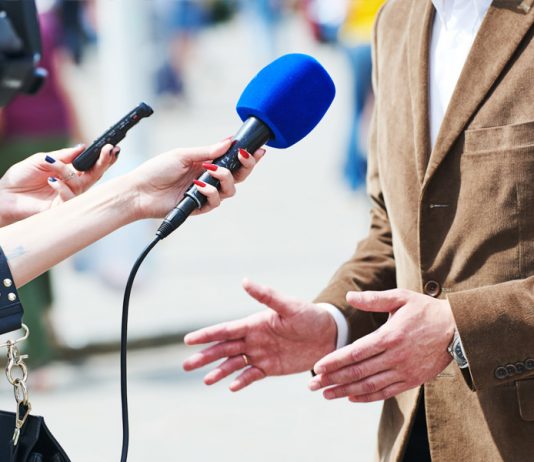 Speaking into microphone